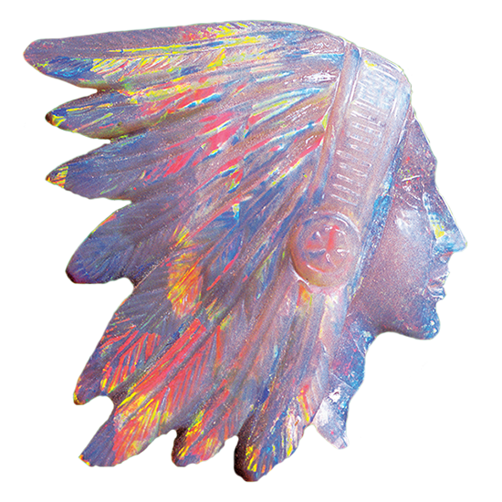 carved opal of a human side profile wearing a traditonal native American headdress