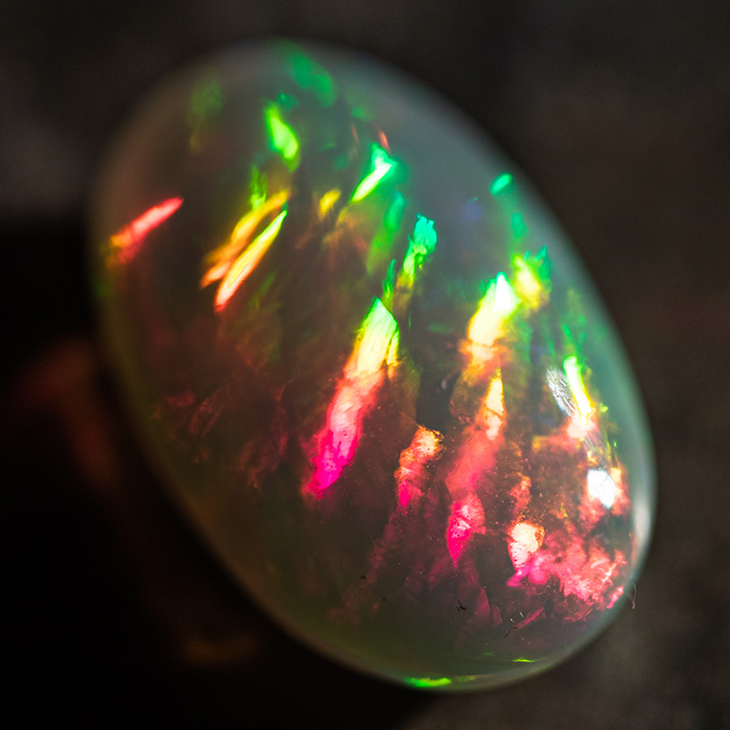 cut light opal with red, yellow and green flashes