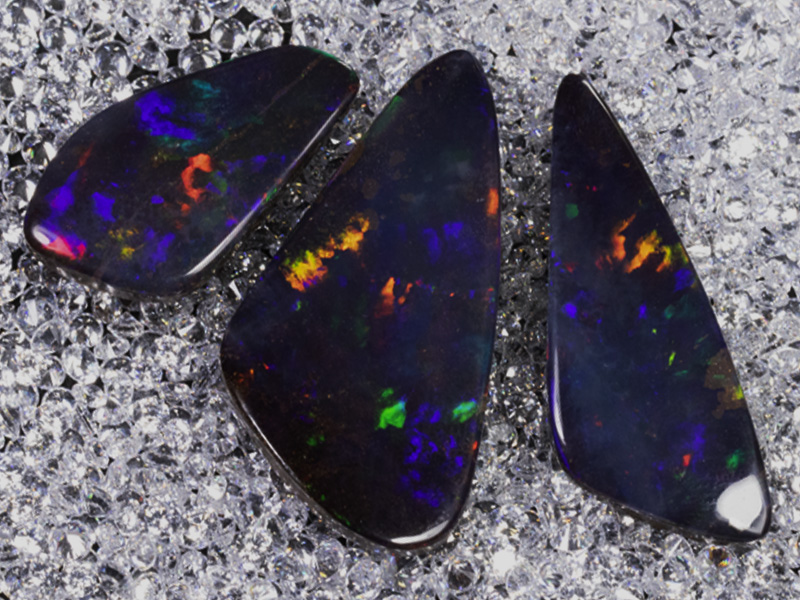 cut boulder opals on cubic zirconias